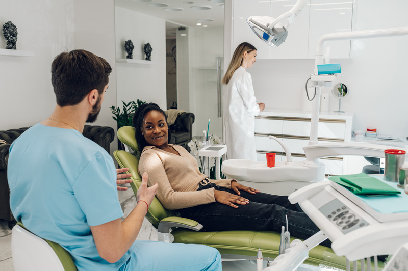 Patient smiling at orthodontist during orthodontics consultation